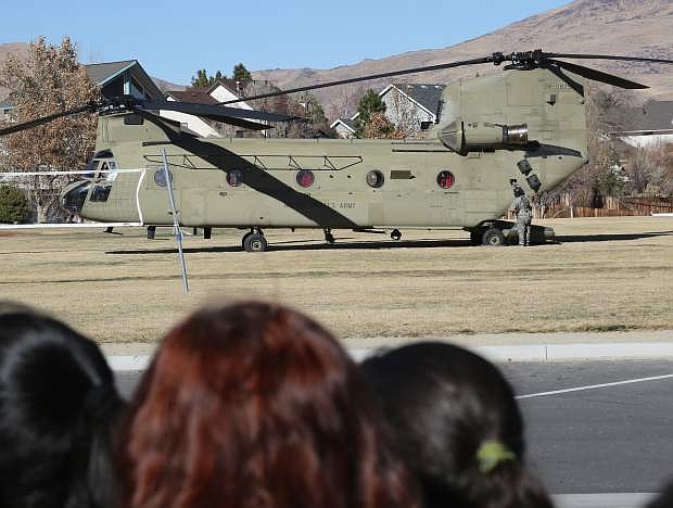 An Army National Guard helicopter lands in front of Eagle Valley Middle School on Tuesday afternoon.