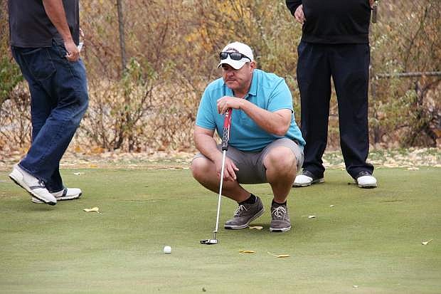 Tomas Kutansky guages his put during a hole at the Fallon Golf Course.