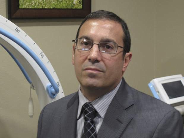 Dr. John DiMuro, Nevada&#039;s former chief state medical officer, poses for a photograph taken in his Reno medical office Tuesday, Nov. 28, 2017, in Reno, Nevada. The anesthesiologist who has returned to private practice since he resigned Oct. 30 is defending the protocol he approved for the drugs scheduled to be used in Nevada&#039;s first execution in 11 years. (AP Photo/Scott Sonner)