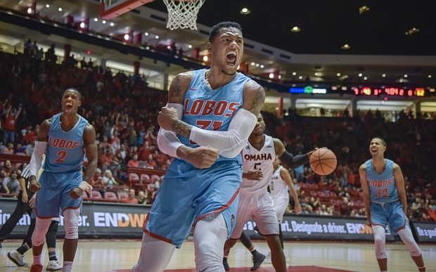 New Mexico&#039;s Troy Simons reacts after a dunk against Omaha during a game Tuesday in Albuquerque, N.M.