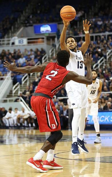 Nevada&#039;s Hallice Cooke passes against Davidson during Tuesday&#039;s victory in Reno.