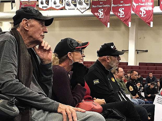Veterans and family members listen to Air Force veteran Kara Miller&#039;s speech at Sierra Lutheran High School on Friday.