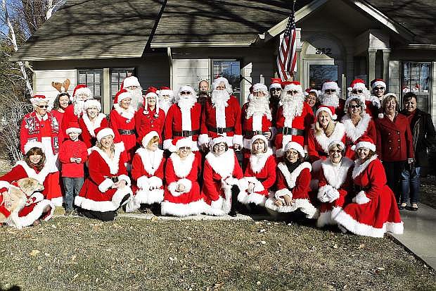 Friends to All, Inc. volunteers pose before delivering gifts to seniors.