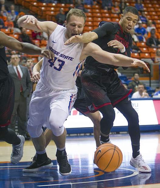 Boise State forward Chris Sengfelder fights for a loose ball with Southern Utah&#039;s Jamil Jackson in a game on Nov. 12 at Taco Bell Arena in Boise, Idaho. Boise State won, 90-69.