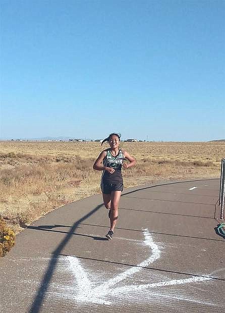 K Usuma Chompaeng runs the course in Sparks during the regional cross country race.