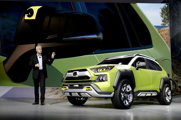 Jack Hollis, group vice president and general manager, Toyota Division at Toyota Motor North America, talks about the Toyota FT-AC concept SUV during the Los Angeles Auto Show, Thursday, Nov. 30, 2017, in Los Angeles. (AP Photo/Chris Carlson)