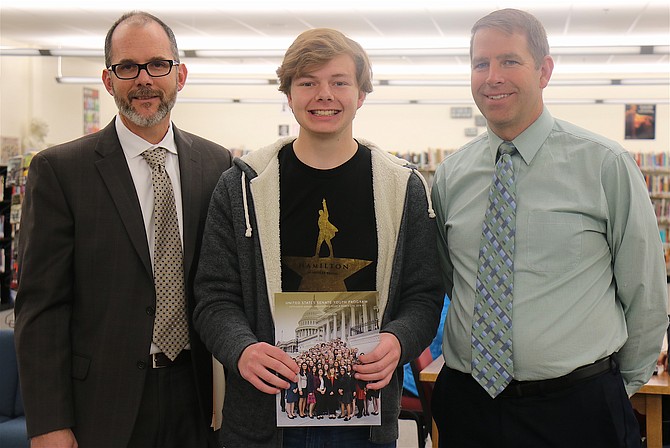 From left, State Superintendent of Public Instruction Steve Canavero presents Churchill County High School student Dawson Frost, middle, the U.S. Senate Youth Program scholarship with Principal Kevin Lords, right. 