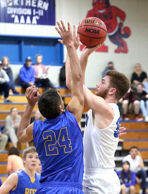 Derek Barry shoots a jump shot over a Reed defender on Tuesday night.