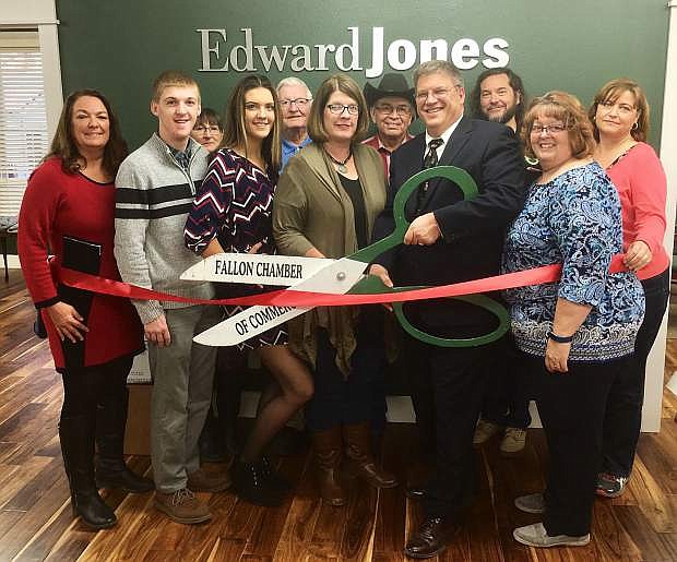Doug Drost had a ribbon cutting and grand opening for his new office on South Taylor Street. Back row from left are Lisa Gonzales, Chamber of Commerce; John Tewell, retired councilman and Chamber of Commerce; Davey Munoz; Nate Helton, executive director of Churchill Economic Development Authority; and Christy Lattin, Chamber of Commerce. Front row from left are Lucy Carnahan, executive director, Chamber of Commerce; Hunter Drost, Sydney Drost, Shawn Drost, Doug Drost and Cynthia McGarrah.