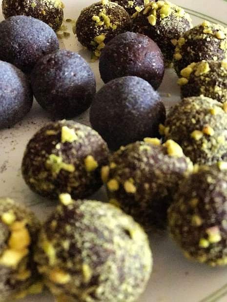 Chocolate cherry truffles rolled in crushed pistachios, matcha powder and cacao powder.