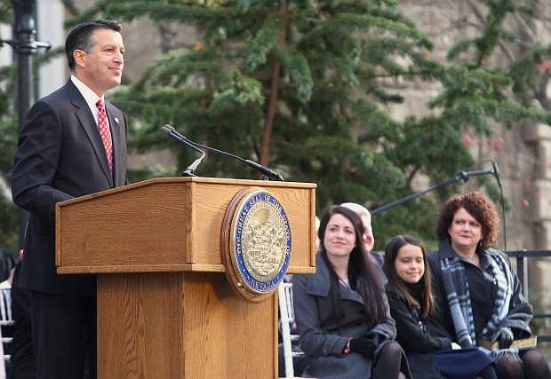 As his family looks on, Gov. Brian Sandoval speaks to a large crowd at his inaugural ceremony on Jan. 5.