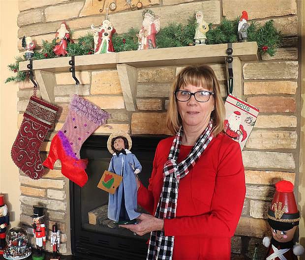 Sue Buckner, committee chair of the annual Christmas Home Tour, is showcasing her vintage caroler collection, which also will be featured during her tour Saturday.
