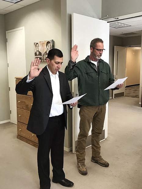 Carson City Sgt. Daniel Gonzales and former Chief of Juvenile Services Ben Bianchi are sworn in as the newest members of the Juvenile Services Probation Committee.