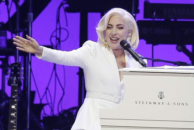 FILE--In this Oct. 21, 2017, file photo, Lady Gaga performs during a hurricanes relief concert in College Station, Texas. Lady Gaga will join the list of superstars with regularly scheduled shows in Las Vegas in 2018, when she kicks off a two-year residency in December. (AP Photo/LM Otero, file)