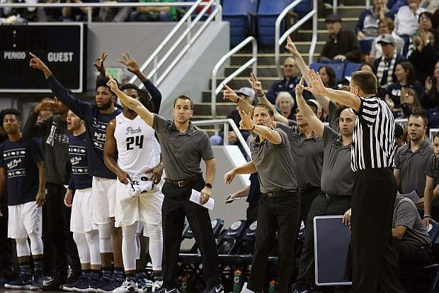 The Nevada bench reacts to UC Davis having 3 seconds left on the shot clock in the first half of a game on Tuesday, Dec. 19, 2017 in Reno.