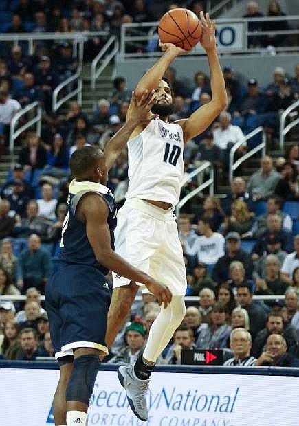 Nevada&#039;s Caleb Martin fades back for a jump shot over UC Davis on Tuesday, Dec. 19, 2017 in Reno.