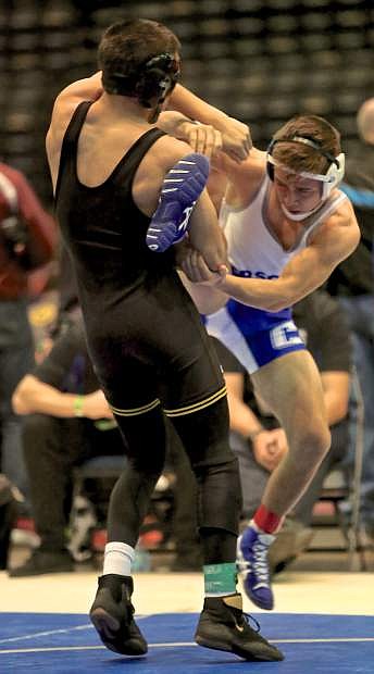 Carson&#039;s Kyler Rudy tries to escape the grasp of Gabriel Castaneda of Yuma, Arizona&#039;s Cibola H.S. Friday morning at the Tournament of Champions in Reno.
