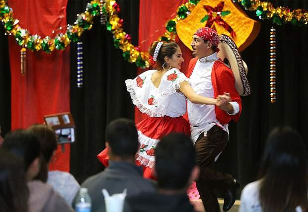 Dancers with the Ballet Folklorico International in Reno perform at the Posada Celebration at Western Nevada College in Carson City, Nev., on Saturday, Dec. 16, 2017. The holiday event, hosted by the Latino Cohort, includes traditional Latino food, games and dancing. Photo by Cathleen Allison/Nevada Momentum