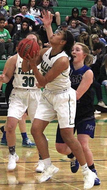 Fallon&#039;s Lailani Otuafi goes for a basket against the Northern 4A McQueen Lady Lancers.