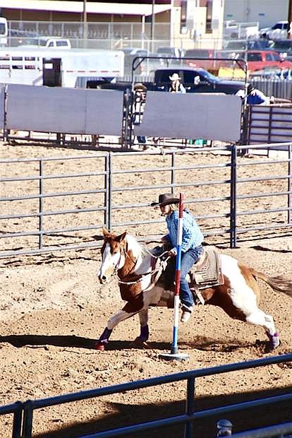 Churchill County Middle School 8-grader Reese Waggoner rides the pole bending course during the last high school rodeo of the winter season.