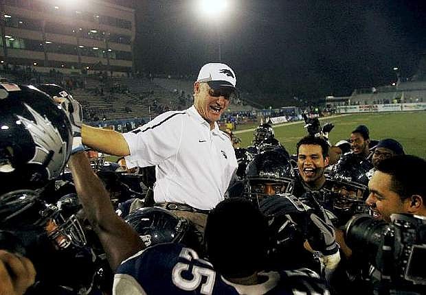 Nevada Wolf Pack head coach Chris Ault sits on the shoulders of his players in celebration of his 200th win at Mackay Stadium in Reno on Oct. 9, 2010.