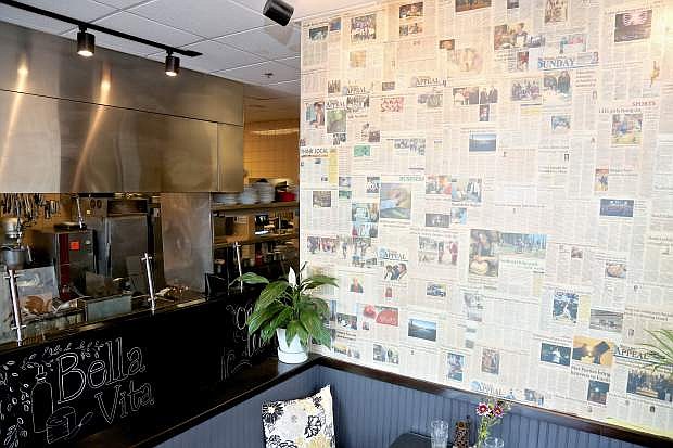 The dining area at Bella Vita is wallpapered with issues of The Nevada Appeal.