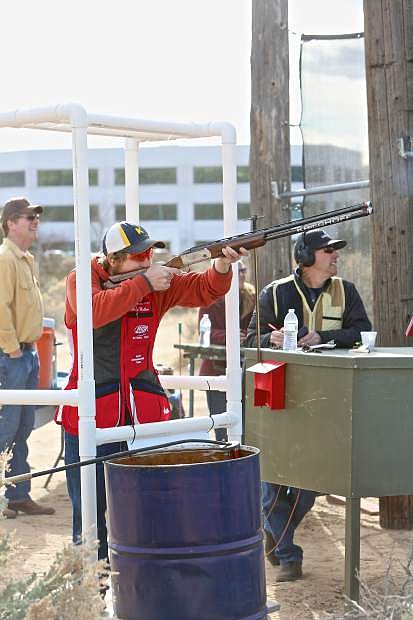 Five-time world champion team member Casey &#039;Jake&#039; Wallace shoots his clay pigeons Thursday at the Capitol City Gun Club.