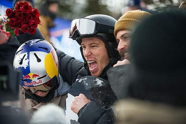 Shaun White poses for a photo before accepting his gold medal at the U.S. Grand Prix in Snowmass on Saturday.