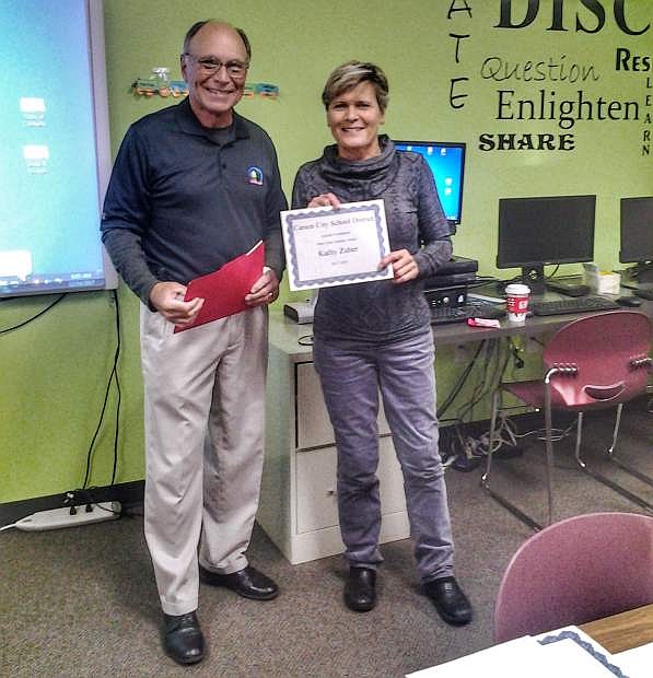 Keith Squires, CCSF board member and retired school administrator, awarding the mini-grant certificate to Kathy Zuber, fourth grade teacher at Bordewich Bray Elementary.