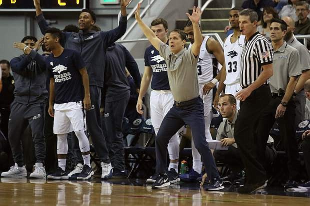 Nevada coach Eric Musselman fires up his players in the first half.