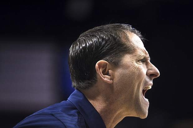Nevada head coach Eric Musselman shouts to his players while taking on New Mexico during an NCAA college basketball game in Reno, Nev., Saturday, Dec. 30, 2017. Nevada won, 77-74. (Jason Bean/The Reno Gazette-Journal via AP)
