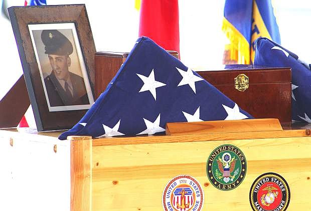 A photo of Army Spec. Larry Bonagofsky and two urns lie in state before a ceremony Friday at the Northern Nevada Veterans Memorial Cemetery in Fernley.