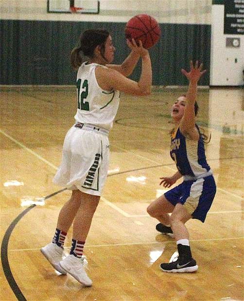 Alexis Jarrett shoots for the basket against Lowry. Saturday was the Lady Wave&#039;s first basketball game against Lowry since the state championship.