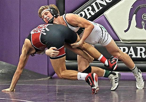Tommy McCormick knocks his opponent over during the 138-pound division&#039;s consolation final.