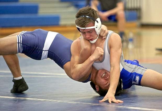 Senator Kyle Rudy makes quick work of Damonte Ranch freshman Kelson Long in a 138-pound match Wednesday night in Reno.