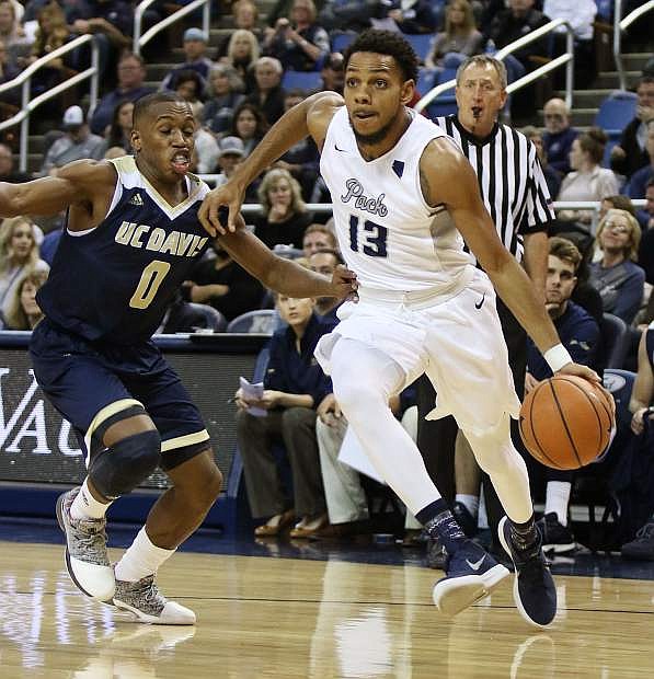 Hallice Cooke drives to the basket against UC Davis earlier in the season.