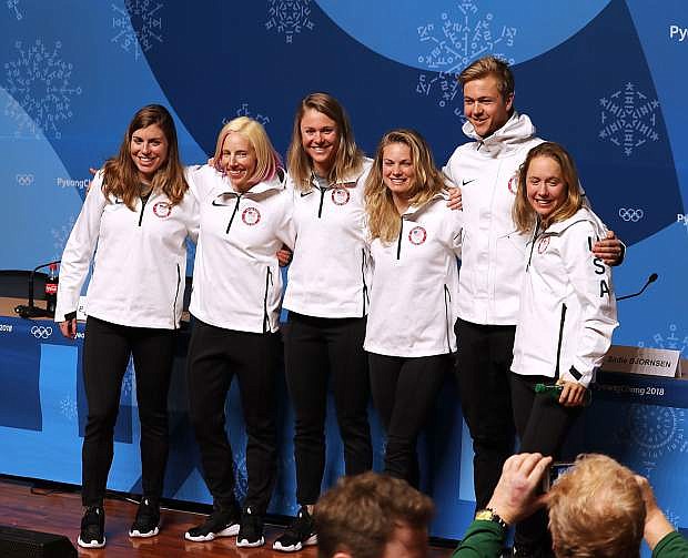 Rosie Brennan, left, poses for a photo Wednesday in Pyeongchang, South Korea, with U.S. cross-country Olympic teammates, from left, Kikkan Randall, Sadie Bjornsen, Jessie Diggins, Erik Bjornsen and Ida Sargent.