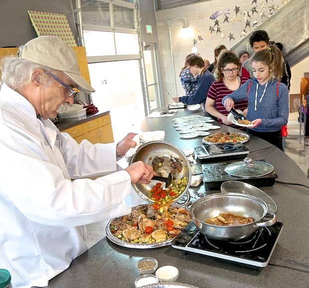 Celebrity chef Charlie Abowd of Adele&#039;s prepares crunchy chicken thighs with zucchini at the Boys &amp; Girls Clubs of Western Nevada.