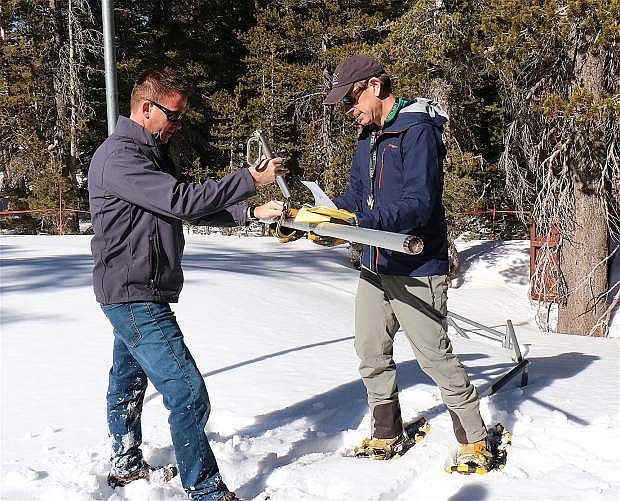 Truckee Meadows Water Authority Senior Hydrologist Bill Hauck, and Jeff Anderson of Nevada Resources Conservation Service, right, conduct monthly snowpack measurements Feb. 5 at Mount Rose summit.