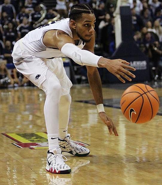 Hallice Cooke of Nevada releases a low pass to a teammate under the basket Wednesday against San Jose State.