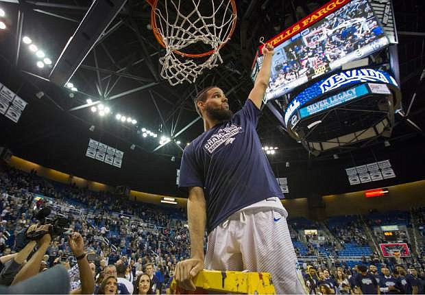Nevada&#039;s Caleb Martin cuts down the net after their win over Colorado State for the Mountain West Championship in a NCAA college basketball game in Reno, Nev., Sunday, Feb. 25, 2018. (AP Photo/Tom R. Smedes)
