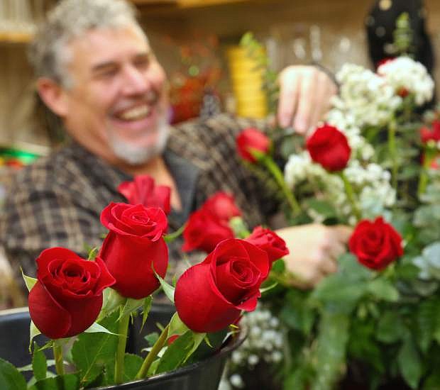 Tom Jones owner of Carson City Florist creates a Valentine&#039;s Day bouquet.