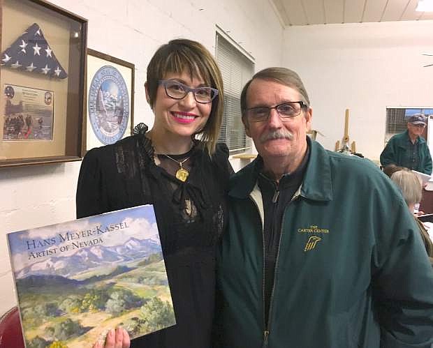 Nevada Museum of Art Communications Director Amanda Horn with the Hans Meyer-Kassel book and Jack Bacon in Genoa on Feb. 6.