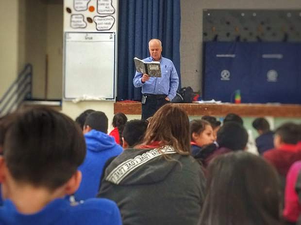 Gary Hogg teaches students at Empire Elementary about writing and storytelling on Monday.