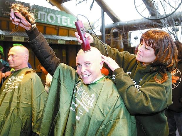 Nevada Appeal File Photo Jessica Wright holds up her braid after getting her head shaved last year during the St. Baldrick&#039;s fundraiser. This year&#039;s event will be Sunday at Red&#039;s Old 395. Proceeds will go to fund cancer-research grants.