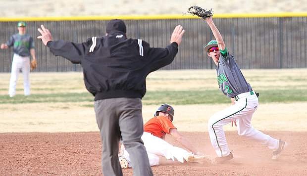 Fallon&#039;s Nate Galusha applies the tag late as umpire Jack Beach calls Fernley safe on Tuesday.