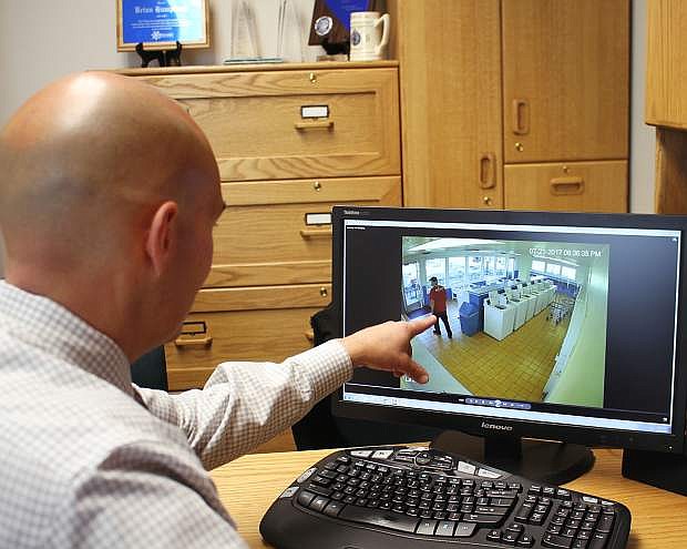 Carson City Sheriff&#039;s Office Capt. Brian Humphrey looks at surveillance video from a local business.