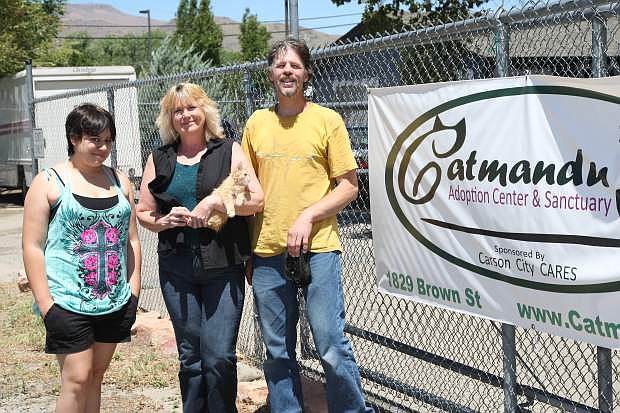 Catmandu volunteers Bridgette McKnight and Cliff Stehlin flank owner Linda Buchanan at their Brown St. Address in Carson City.