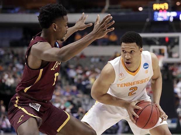 Loyola-Chicago guard Donte Ingram (0) defends against Tennessee forward Grant Williams (2) during the first half of a second-round game at the NCAA men&#039;s college basketball tournament in Dallas, Saturday, March 17, 2018. (AP Photo/Tony Gutierrez)