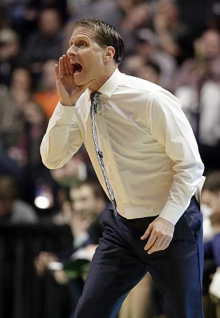 Nevada head coach Eric Musselman yells at his team, during the second half of a second-round game against the Cincinnati, in the NCAA college basketball tournament in Nashville, Tenn., Sunday, March 18, 2018. (AP Photo/Mark Humphrey)